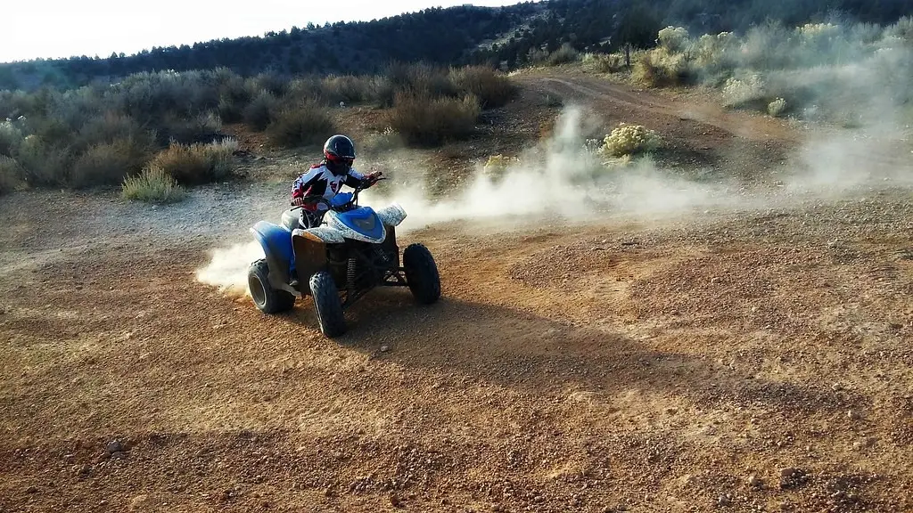 ATV rider kicking up dust on a dirt trail at the Radar Hill off-highway vehicle area