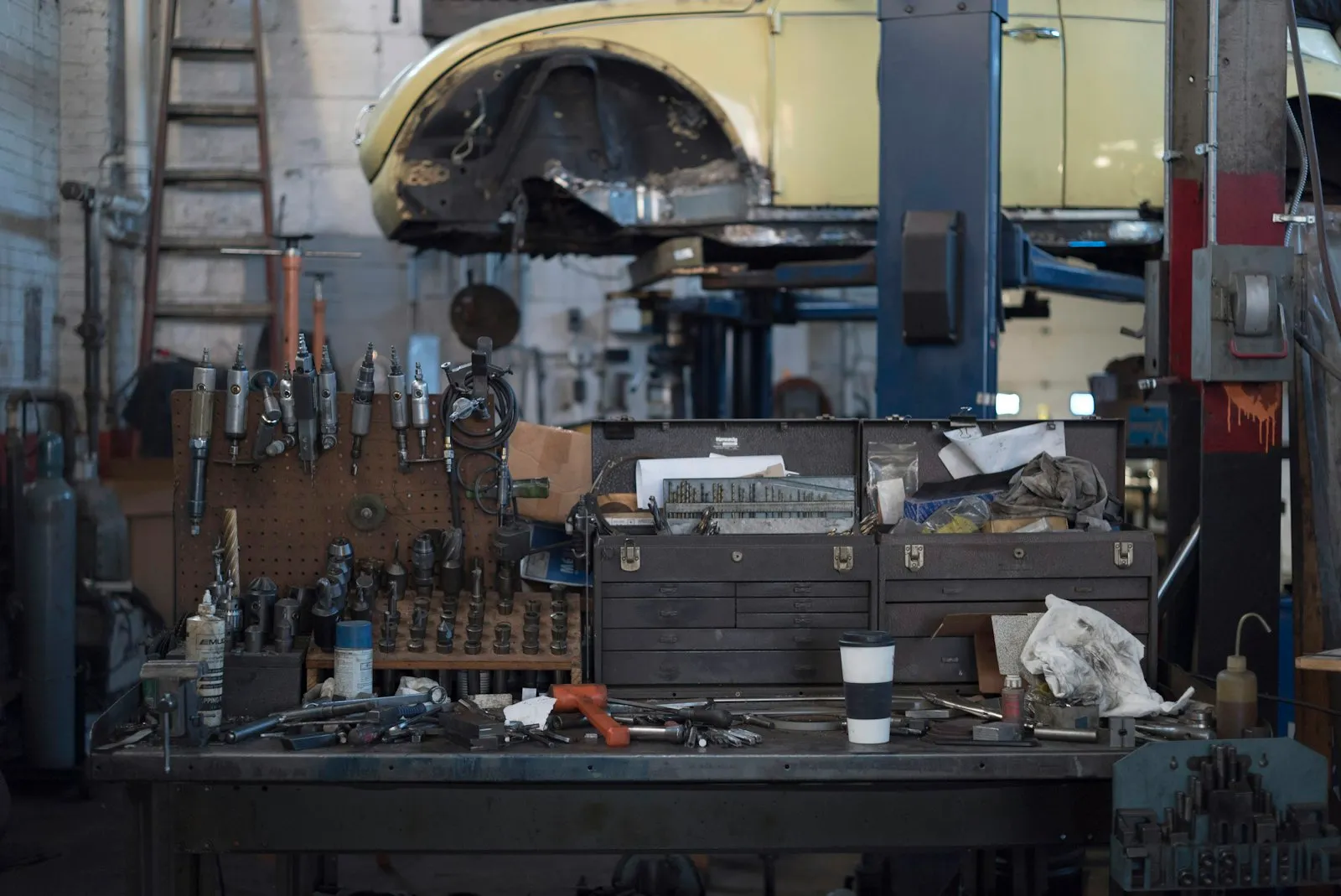 Workbench full of tools — the install setup for a DeWalt 20V MAX battery-powered train horn build