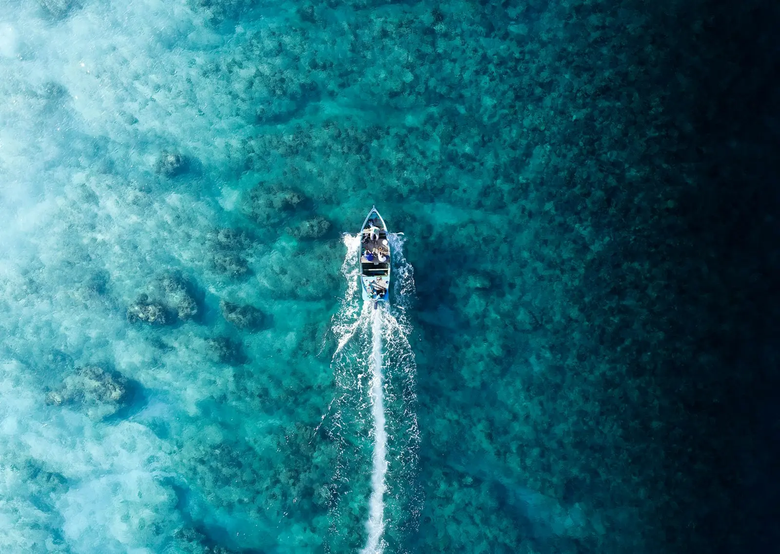 A small boat of fisherman in Fuvahmulah, Maldives heading out for the days work.