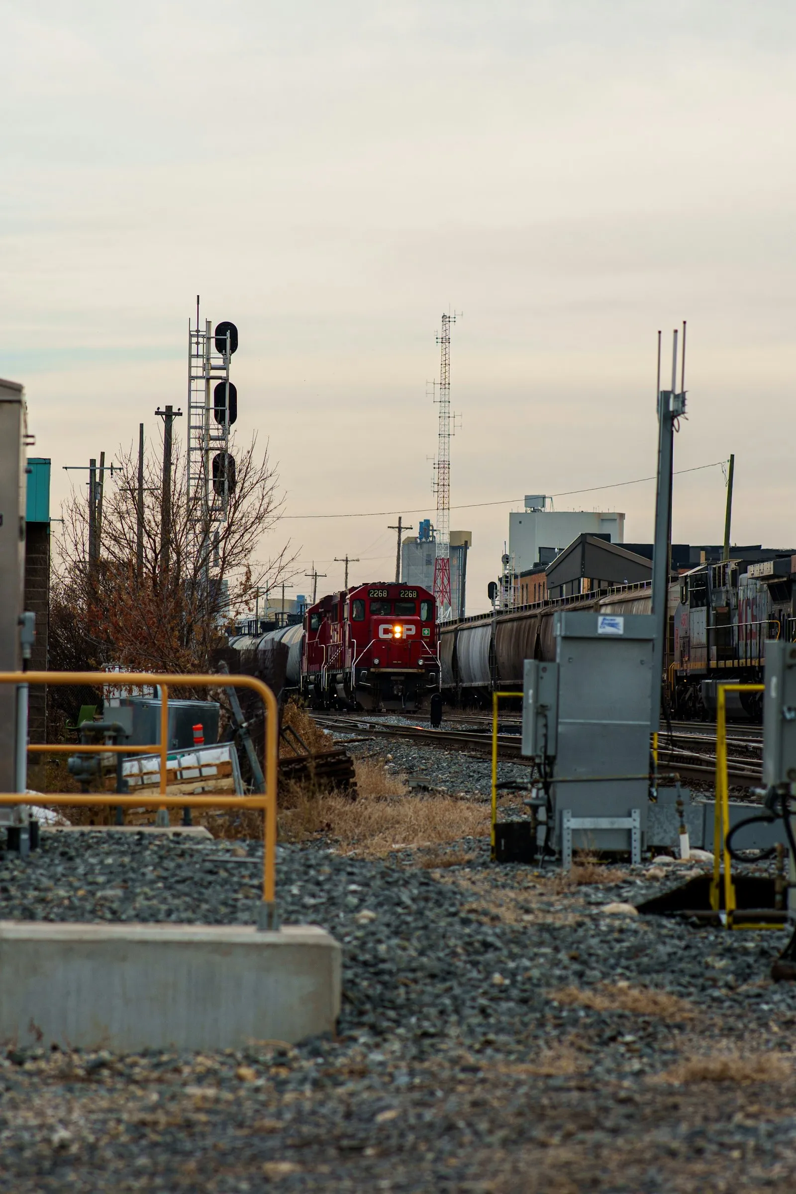 Red freight engine pulling cars — switcher / short-line context where the K3LA still appears