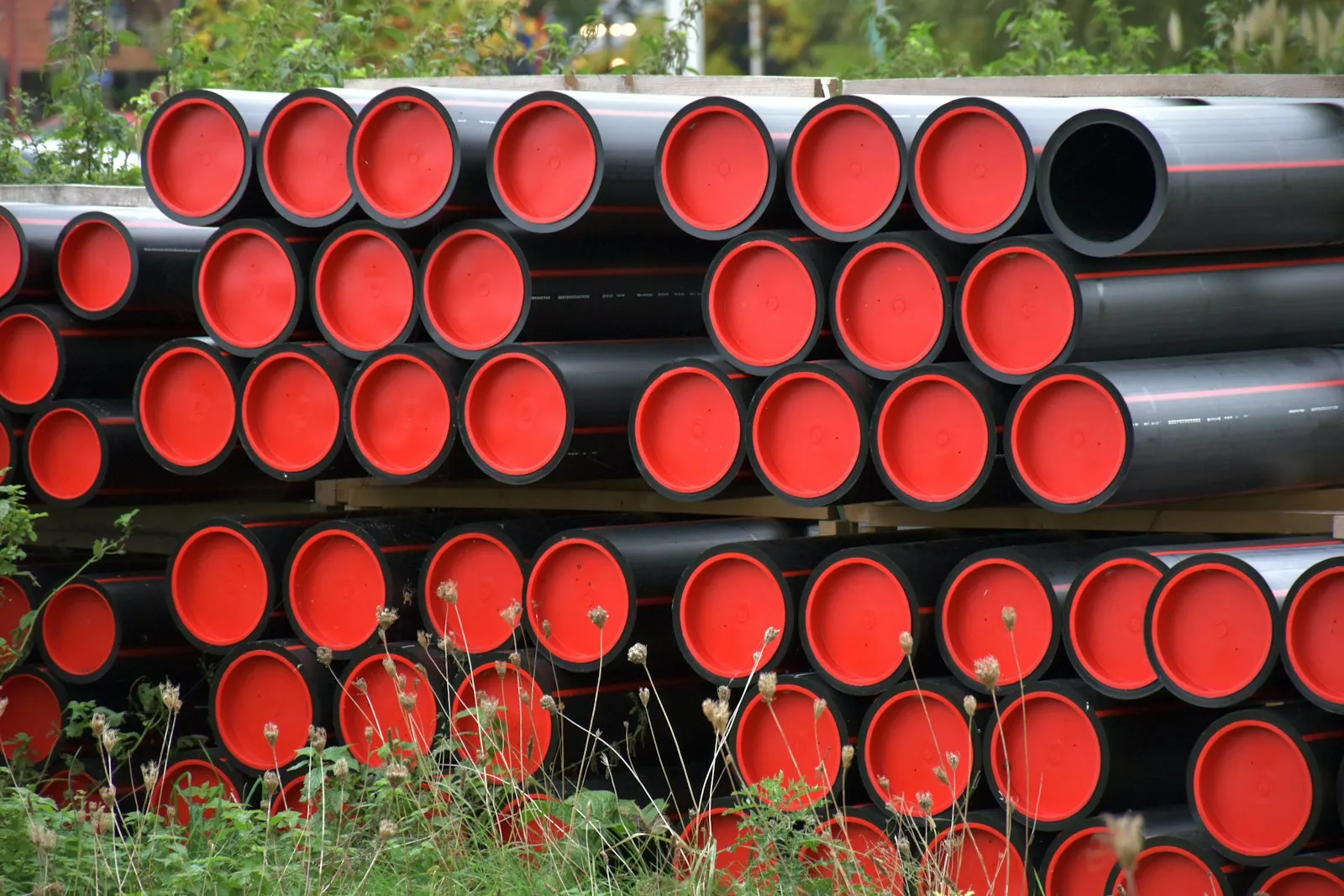 Pile of plastic pipes — the PVC raw material at the heart of the ~120 dB DIY PVC train horn build