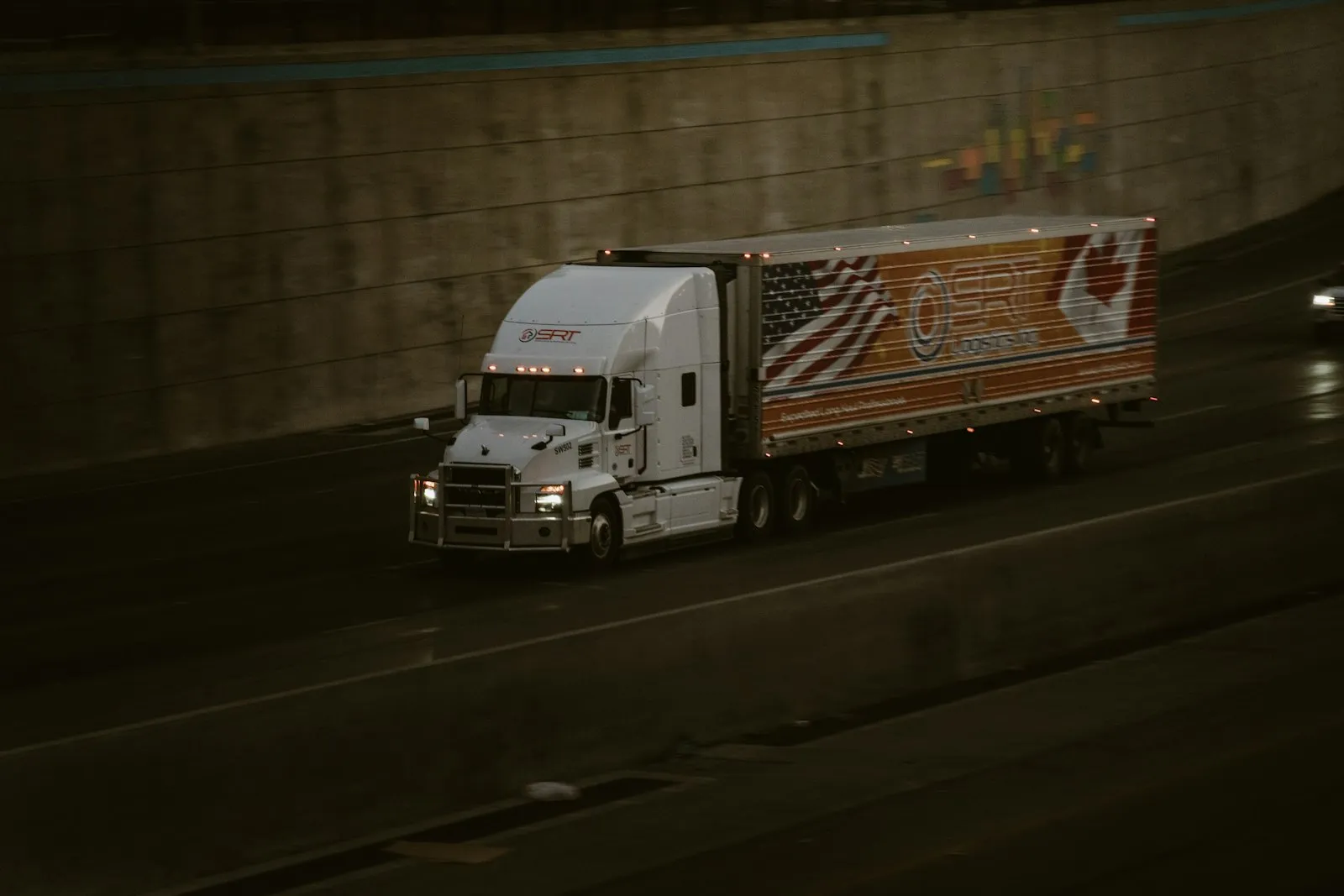 Pink semi-truck with tall chrome exhaust pipes — Class 8 cab context for Grand General brass + chrome trumpets