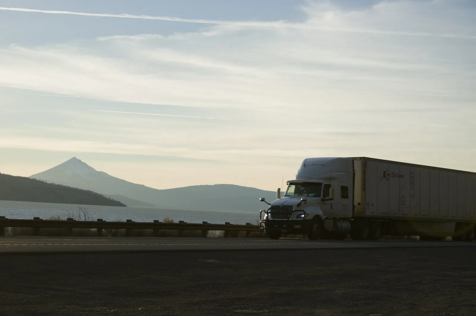 Yellow semi-truck with open doors and exhaust — Class 8 install context for United Pacific chrome zinc-alloy trumpets