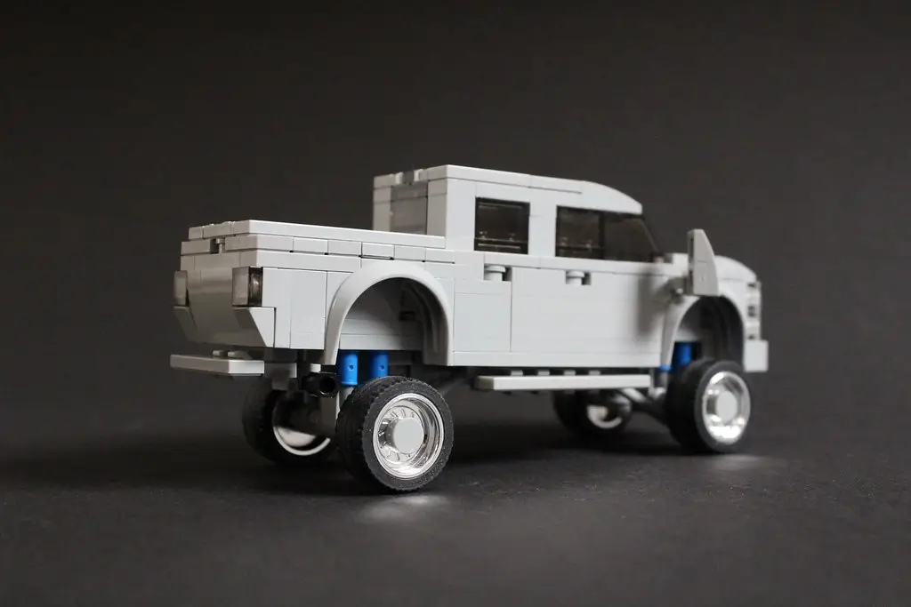 Custom black pickup truck of the kind owners fit with quad-trumpet train horns