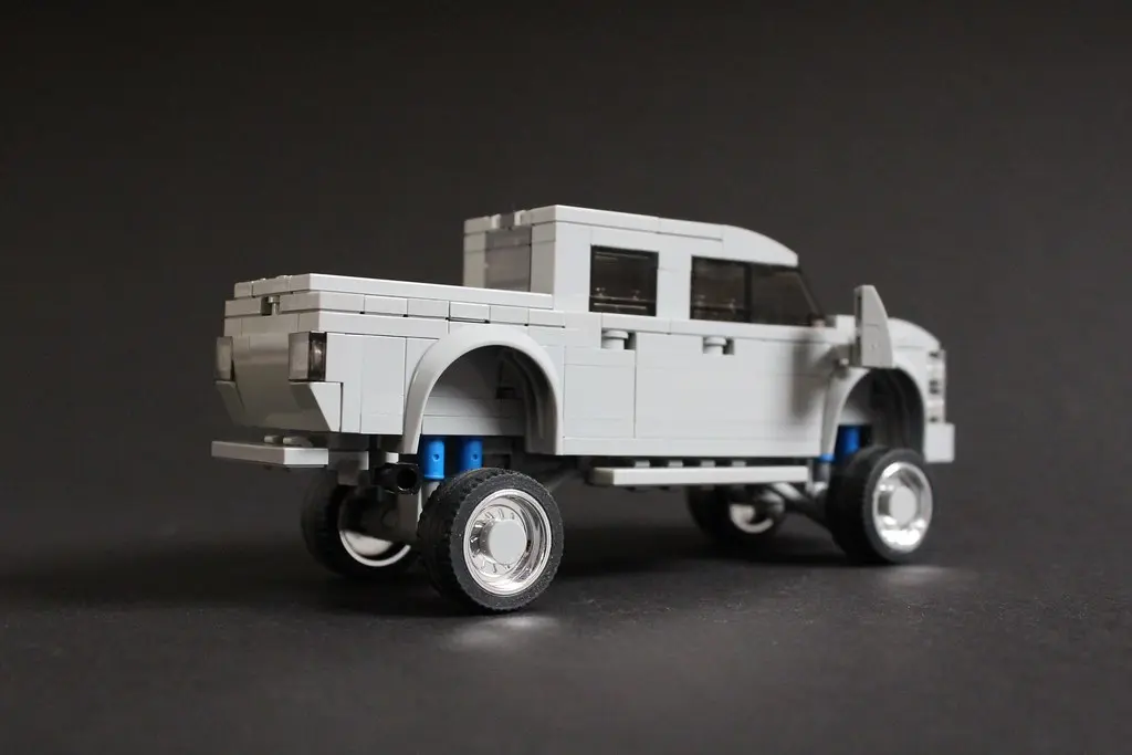 Custom black pickup truck of the kind owners fit with quad-trumpet train horns
