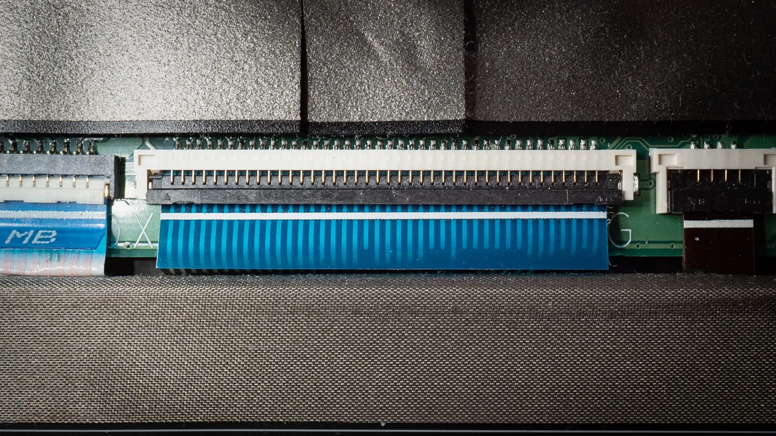 Close-up of car electrical wiring during repair — the kind of harness work a relay-based install requires