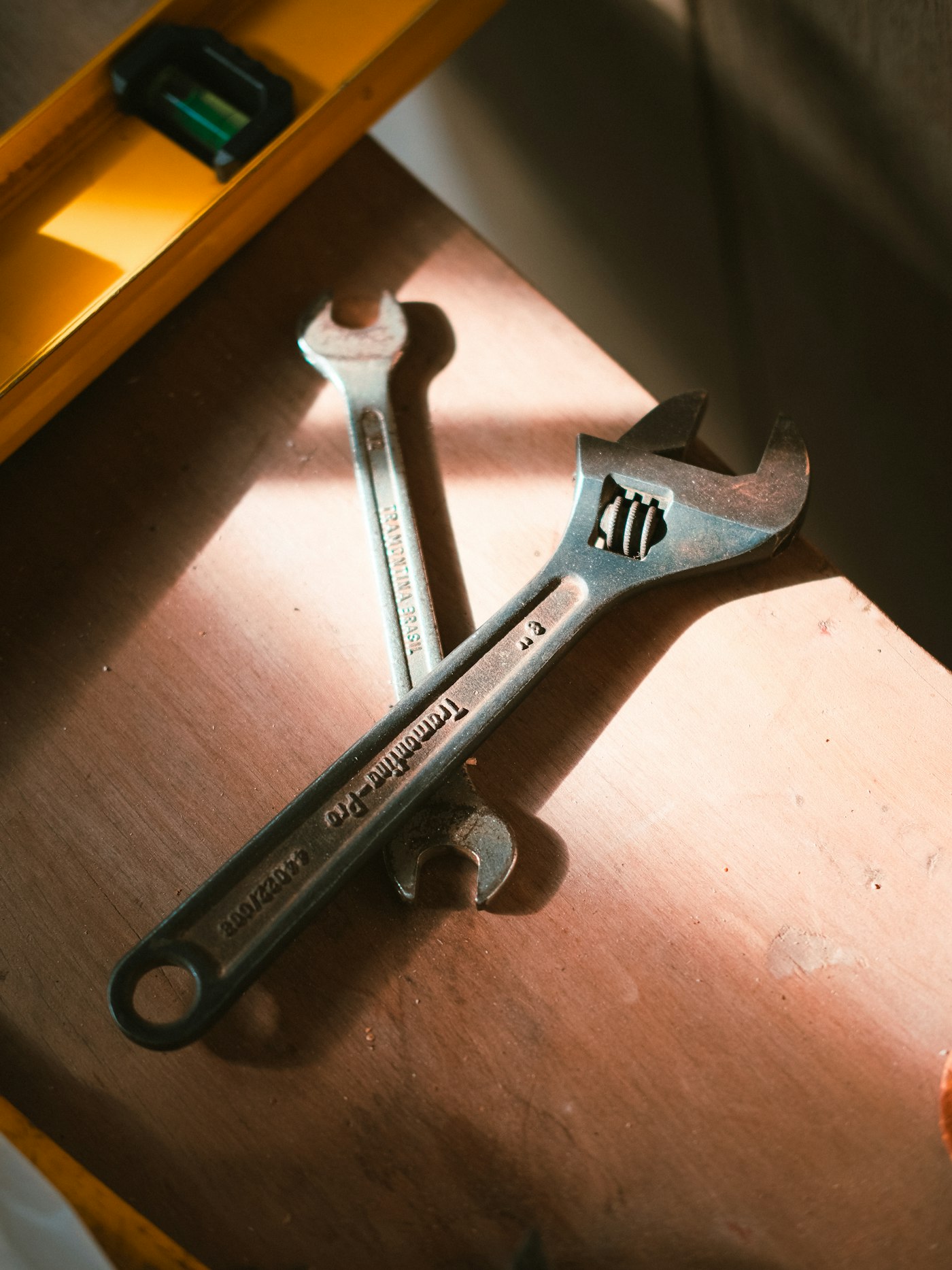 Hand tools on a wooden surface — the post-print finishing tools for 3D-printed bell parts