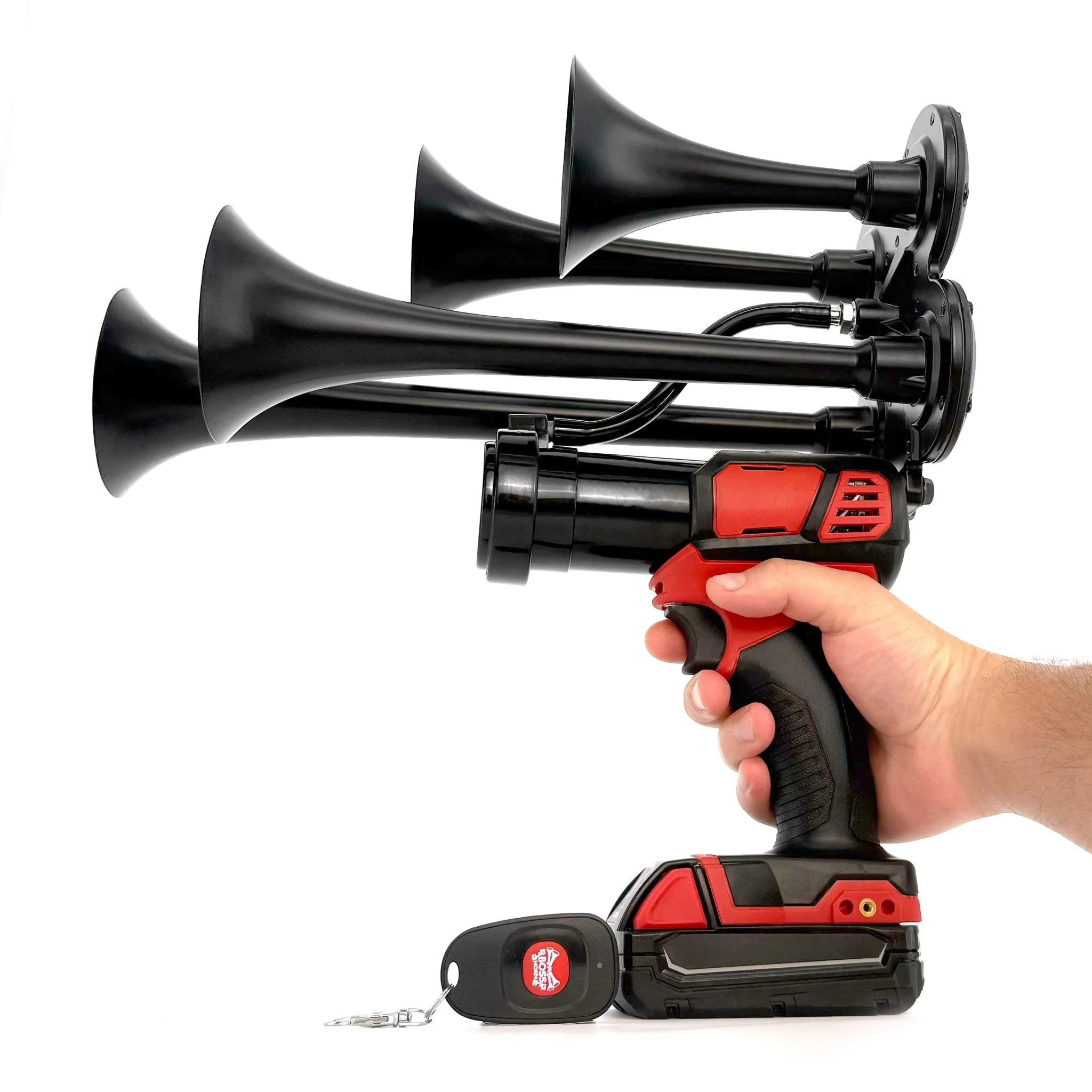 Hand holding the 4 lb BossHorn M18 quad train horn showing its handheld scale